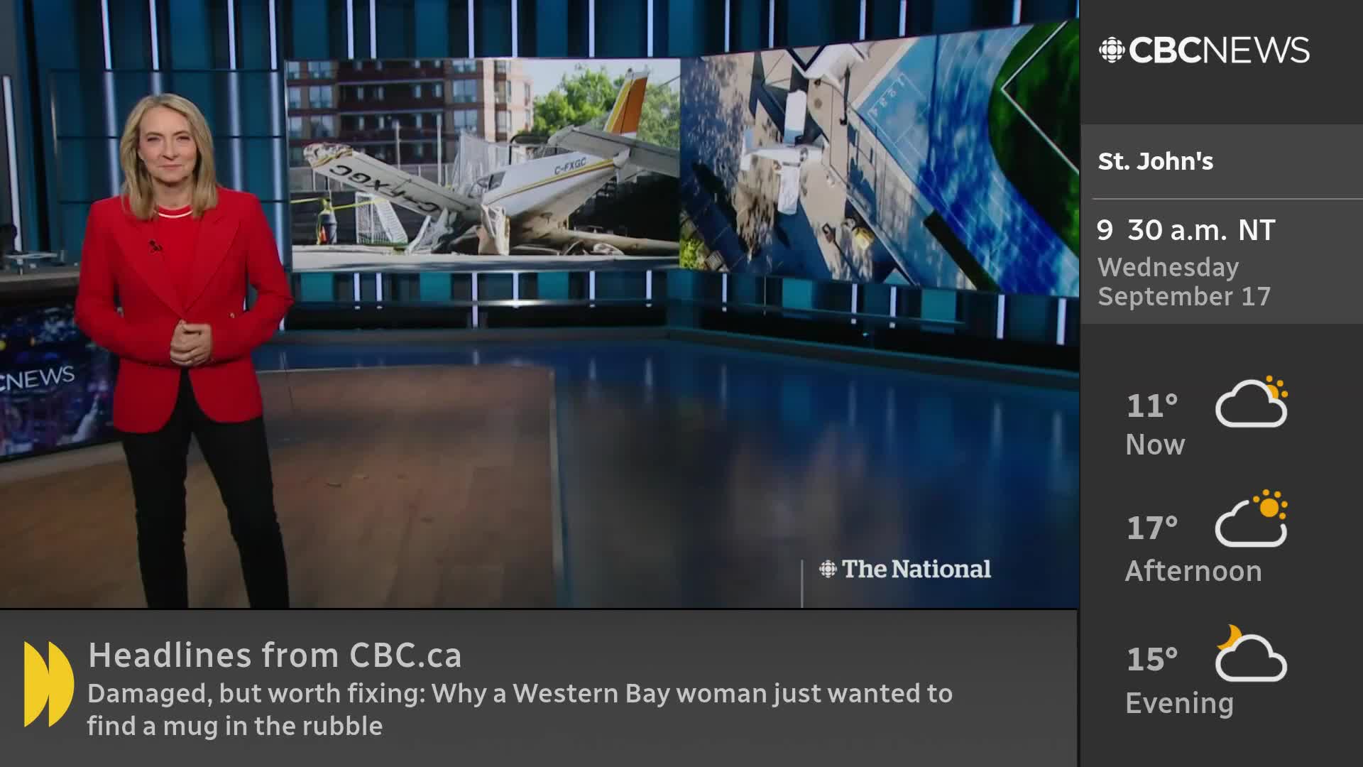 A CBC News anchor stands in a studio, facing the camera with a calm expression. Behind her, screens show images of a damaged airplane, with news headlines scrolling at the bottom.
