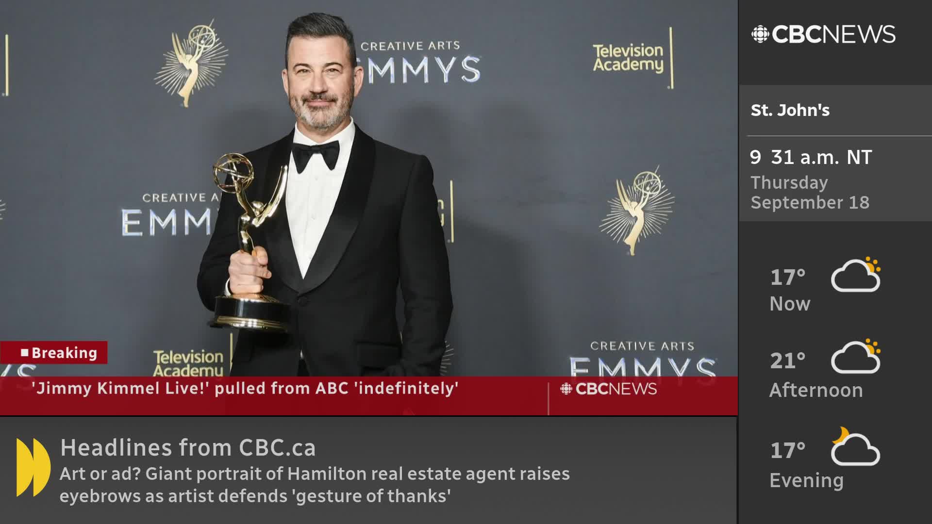 Jimmy Kimmel, in a tuxedo, holds an Emmy award in front of a backdrop with the award show's logo. The CBC News Network is reporting that his show has been pulled from ABC.
