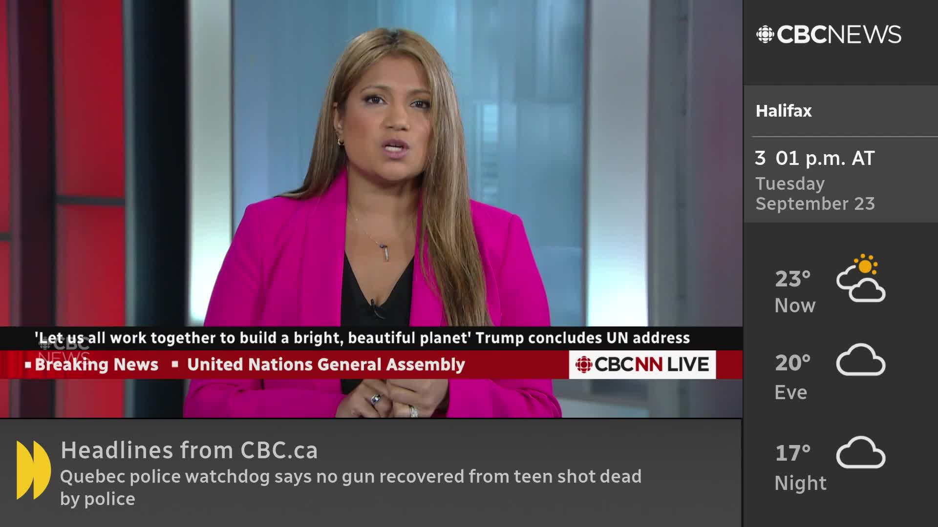 A news anchor in a bright pink blazer is speaking, her mouth moving as she delivers the news on CBC News Network. The screen displays headlines and the weather forecast for Halifax.
