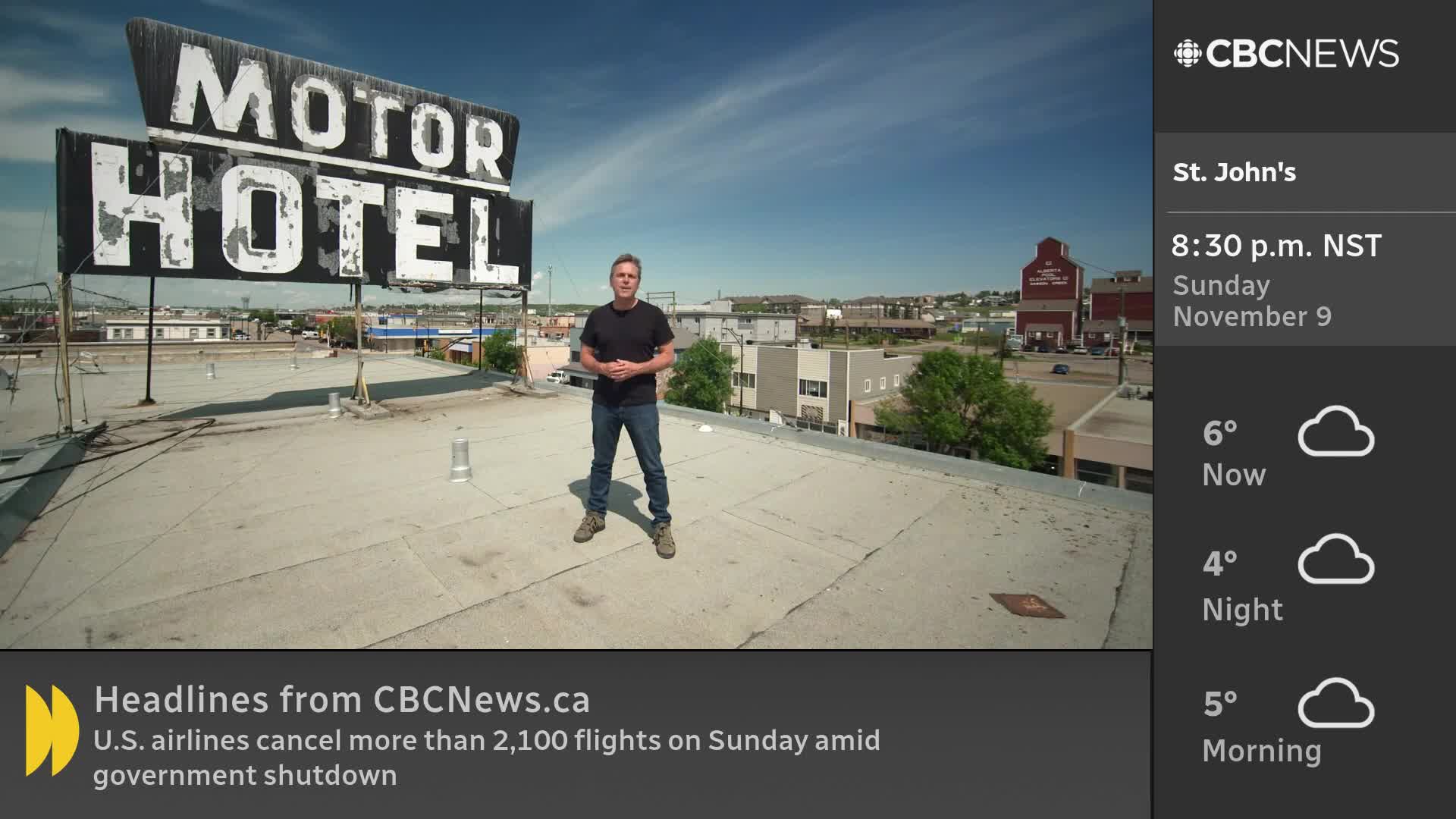 A CBC News Network reporter stands on a rooftop, with a weathered "MOTOR HOTEL" sign behind him. The broadcast is reporting from St. John's, Newfoundland, where it's 6 degrees and cloudy.
