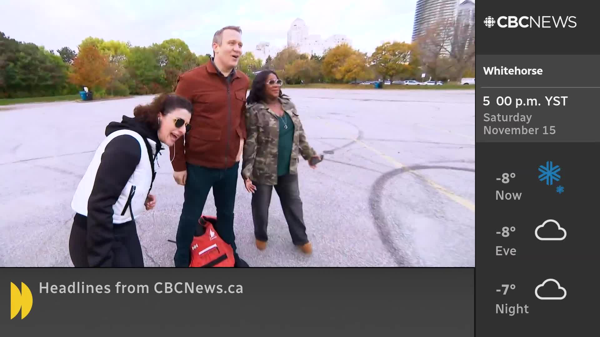 Three people stand on a gray surface, looking toward something out of frame. The CBC News Network logo sits in the corner, with weather information for Whitehorse displayed nearby.
Three people stand on a gray surface, looking toward something out of frame. The CBC News Network logo sits in the corner, with weather information for Whitehorse displayed nearby.