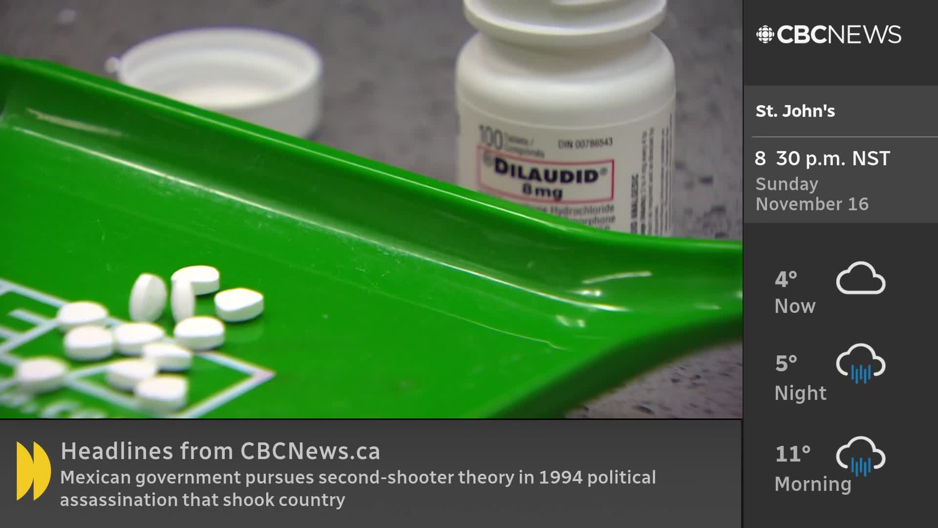 A green pill tray holds a scattering of white tablets, next to a bottle of Dilaudid. CBC News Network is on, showing the time and weather in St. John's.
A green pill tray holds a scattering of white tablets, next to a bottle of Dilaudid. CBC News Network is on, showing the time and weather in St. John's.
