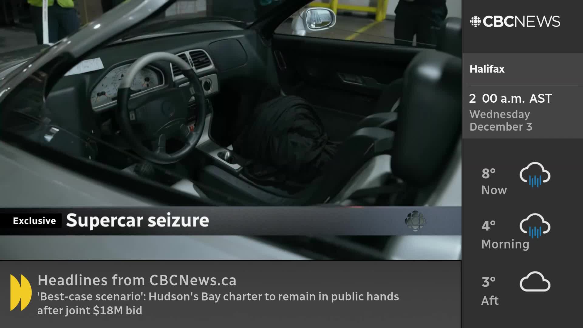 Inside the silver car, a dark, draped object sits on the driver's seat. The CBC News Network graphic labels the scene as a "Supercar seizure" in Halifax.
Inside the silver car, a dark, draped object sits on the driver's seat. The CBC News Network graphic labels the scene as a "Supercar seizure" in Halifax.