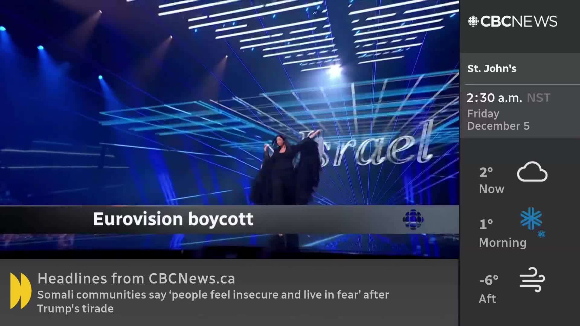 A performer in black stands on a stage, arms outstretched, under bright blue lights. The CBC News Network is reporting on a Eurovision boycott.
A performer in black stands on a stage, arms outstretched, under bright blue lights. The CBC News Network is reporting on a Eurovision boycott.