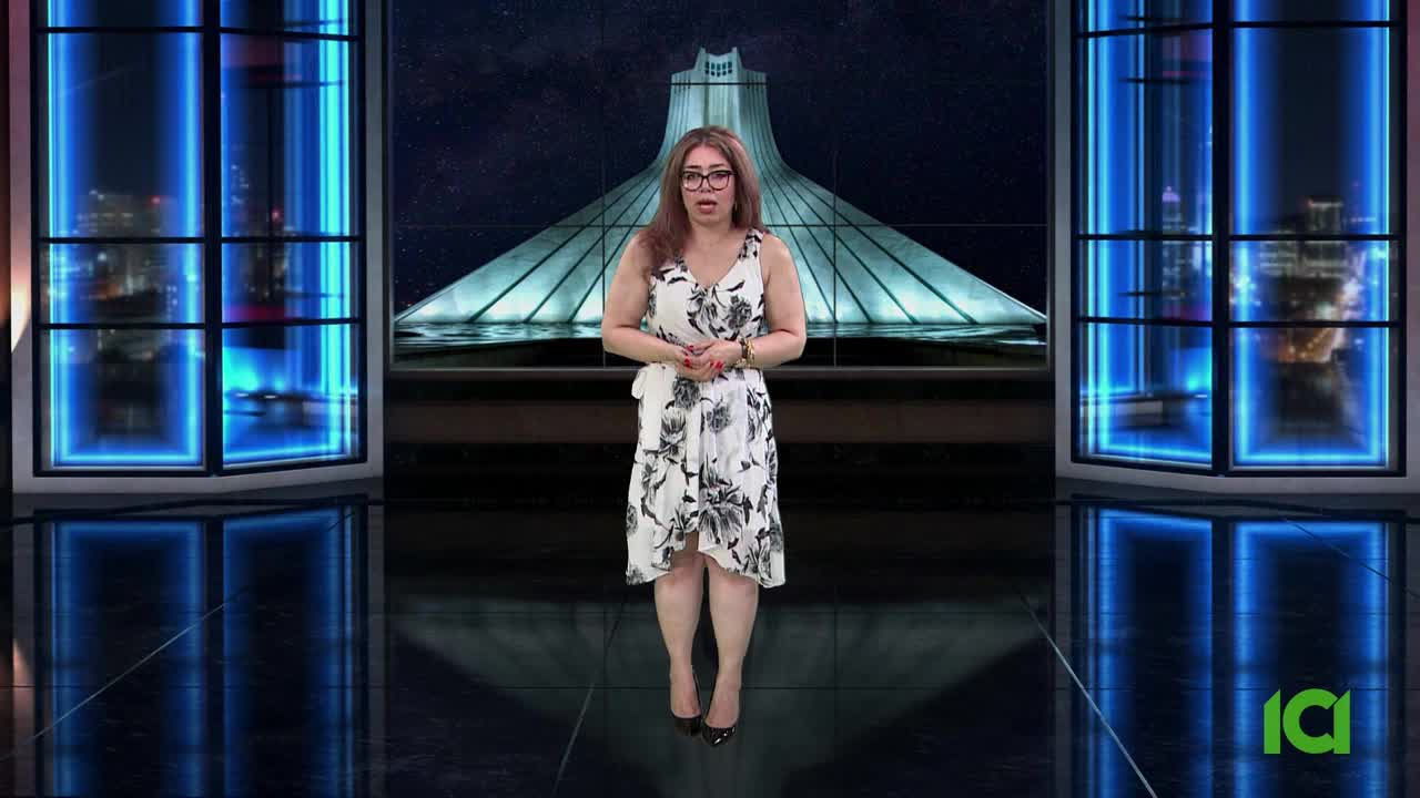 A woman in a floral dress stands center stage, speaking in front of a backdrop featuring a large monument. The CFHD-DT logo is visible in the bottom right corner.
