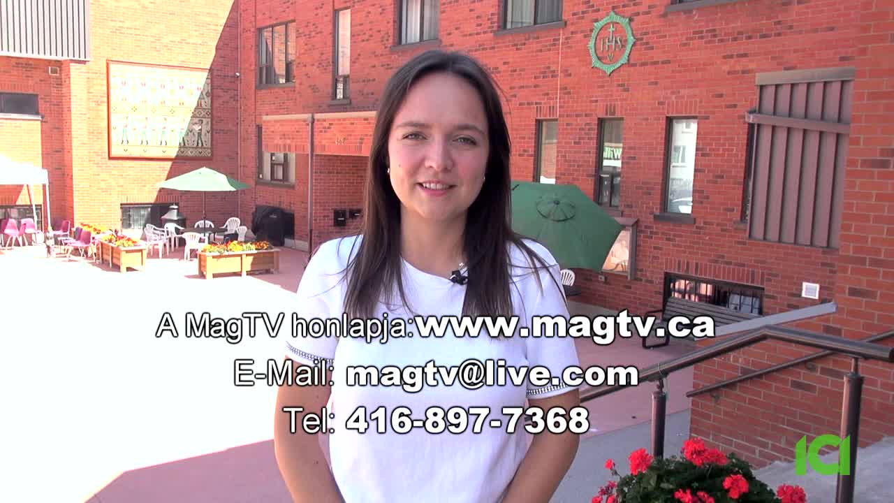 A woman in a white shirt stands in front of a brick building, smiling at the camera. Text about MagTV, including a website and phone number, is superimposed below her.
