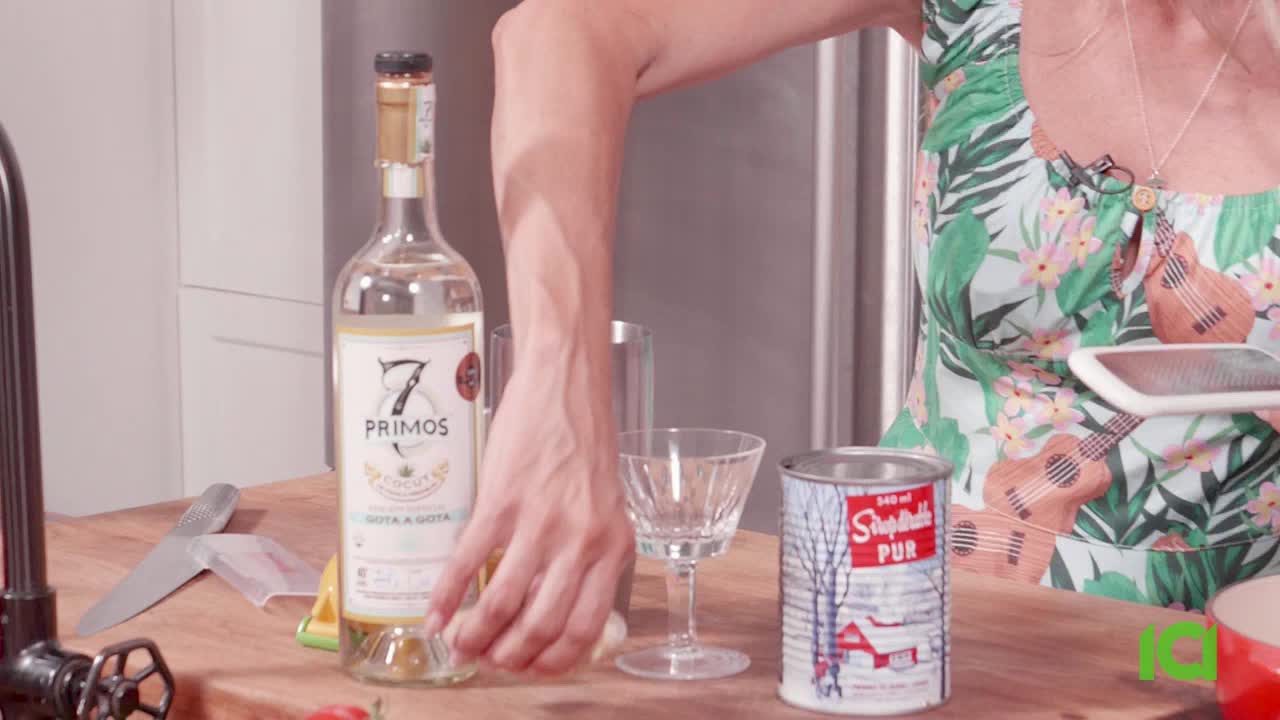 A hand reaches for the bottle of 7 Primos, about to pour. Beside it, a glass and a can of something called "Shepherd's Pur" sit on the countertop.
