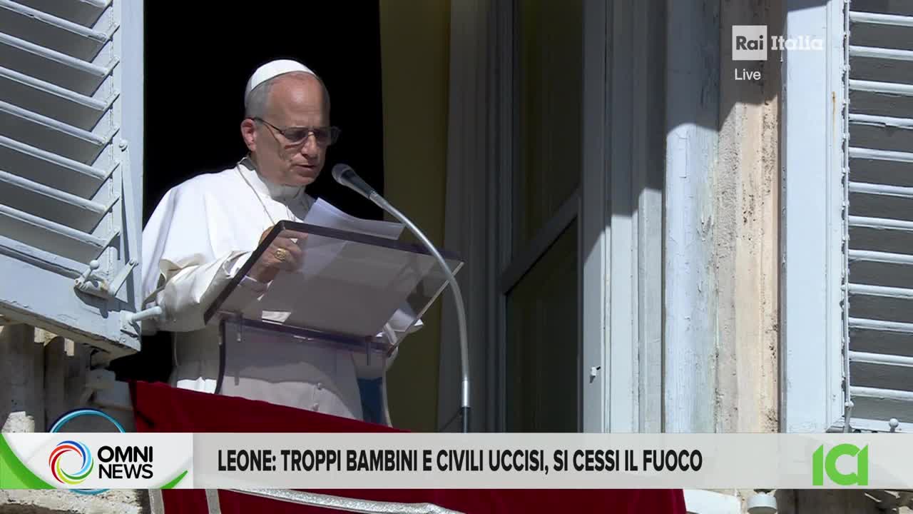 A man in white robes stands at a podium, reading from a paper. The scene is being broadcast live on Rai Italia, with the OMNI News logo visible at the bottom.
A man in white robes stands at a podium, reading from a paper. The scene is being broadcast live on Rai Italia, with the OMNI News logo visible at the bottom.