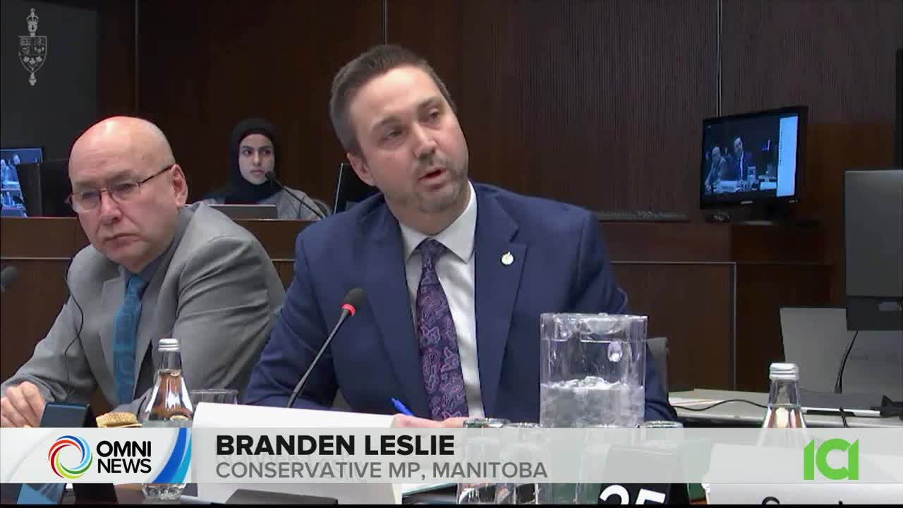 Branden Leslie, the Conservative MP from Manitoba, is speaking into a microphone. The CFHD-DT broadcast shows a panel discussion, with a woman in a hijab and another man listening intently.
