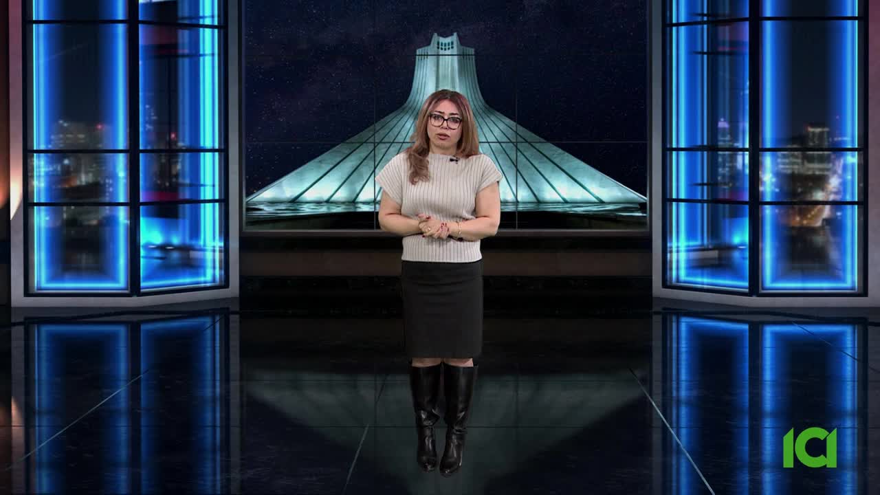 A woman in glasses and boots stands in a studio, her hands clasped in front of her. Behind her, a large screen displays a geometric structure, likely the backdrop for a CFHD-DT broadcast from Canada.
A woman in glasses and boots stands in a studio, her hands clasped in front of her. Behind her, a large screen displays a geometric structure, likely the backdrop for a CFHD-DT broadcast from Canada.