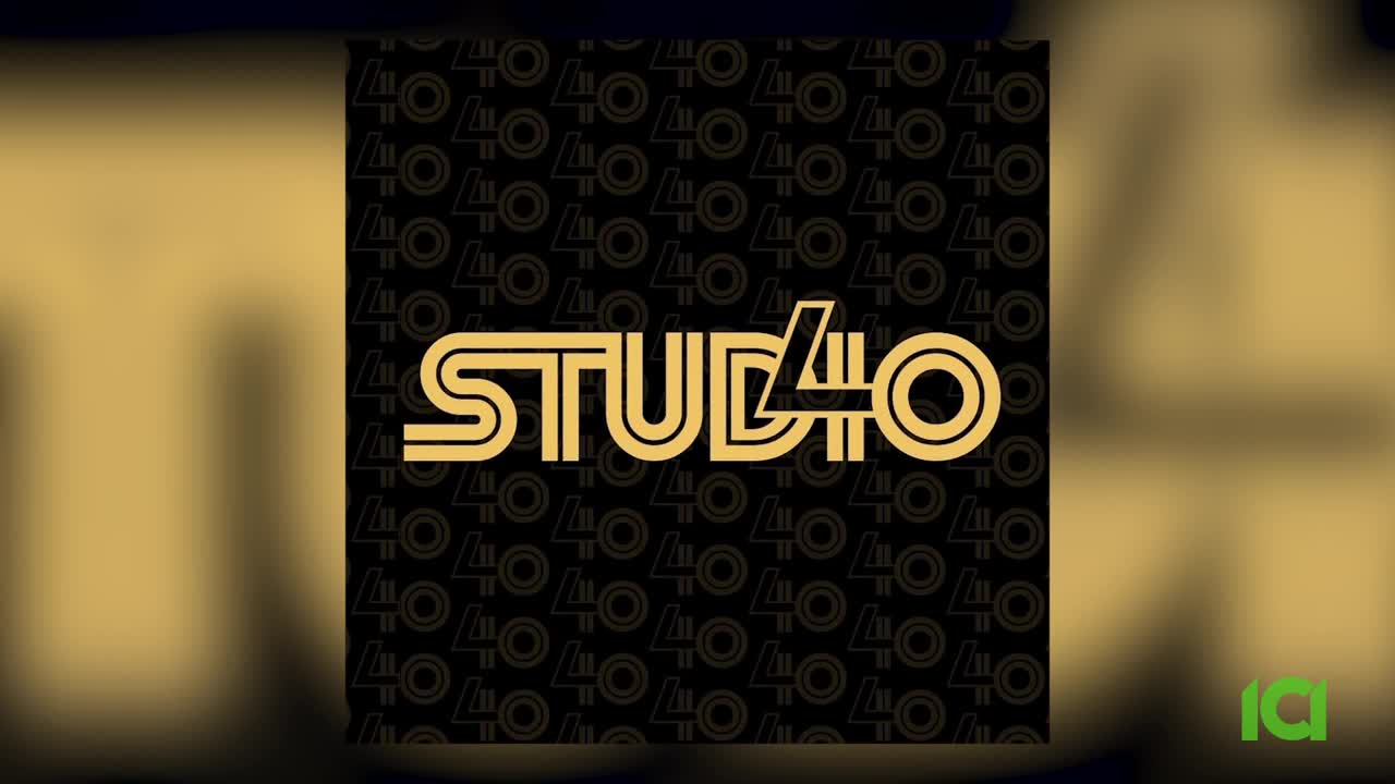 The "STUDIO 40" logo, rendered in bold gold lettering, stands out against a black background patterned with repeating "40" symbols. A small green "ia" logo appears in the lower right corner.