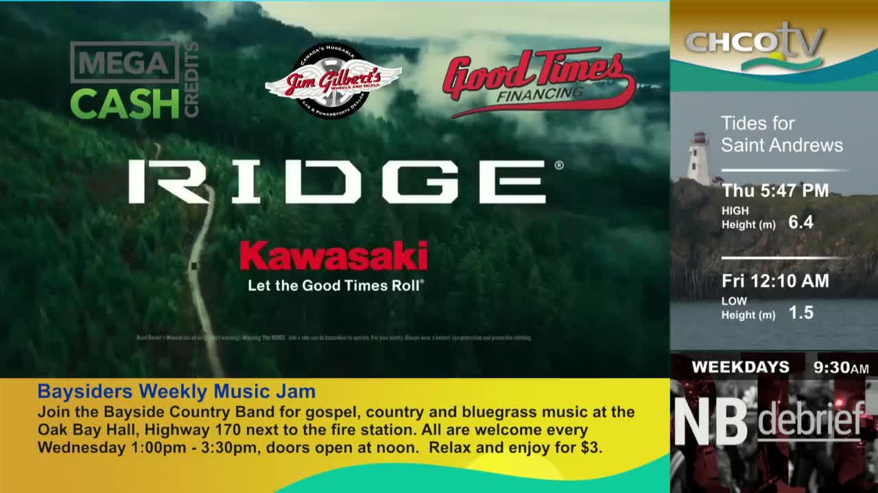 On the CHCO-TV screen, a scenic road winds through a green landscape, and the "Ridge Kawasaki" logo is prominent. To the right, the tide times for Saint Andrews are displayed.
