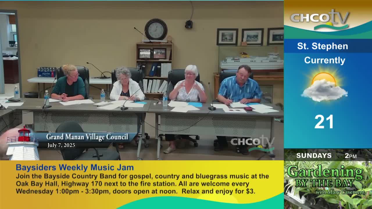 Four people sit at a table, papers and microphones in front of them. The CHCO-TV logo is visible, and the screen shows the Grand Manan Village Council meeting.
