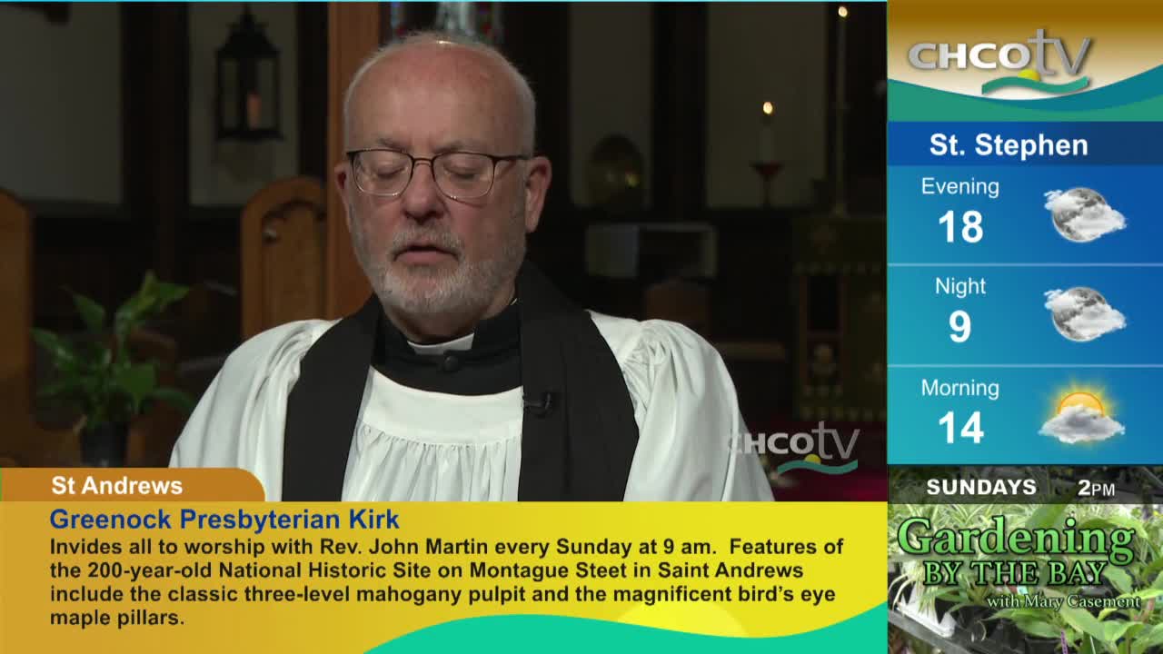 A man in a clerical collar, likely Rev. John Martin, is speaking on CHCO-TV, his eyes closed. The screen shows a weather forecast for St. Stephen, along with information about the Greenock Presbyterian Kirk in St. Andrews.
