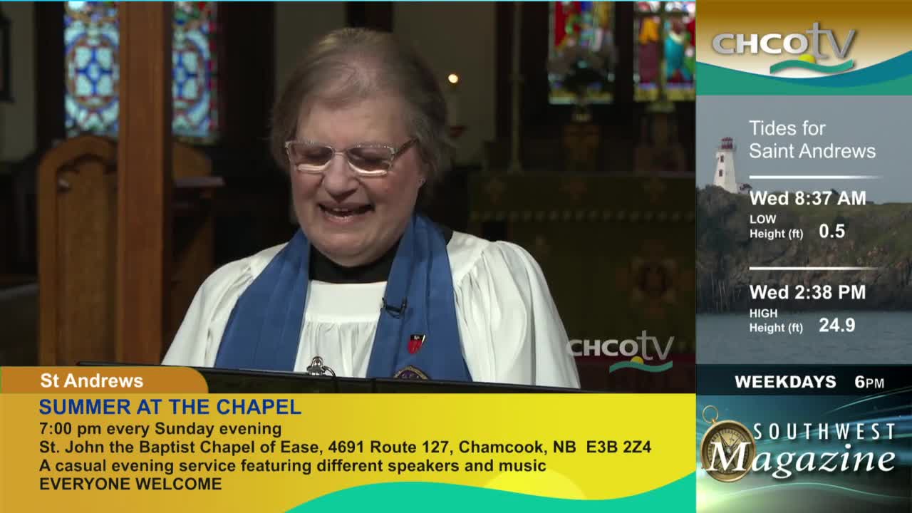 A woman in a clerical collar smiles while speaking at a lectern. The CHCO-TV logo is visible, and a graphic displays tide information for Saint Andrews.
