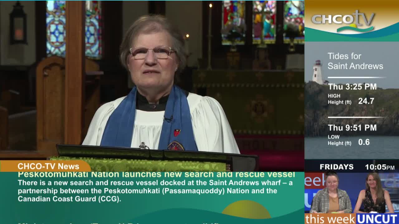 A woman in a clerical collar stands at a lectern, speaking in a church setting. The CHCO-TV news graphic at the bottom details a new search and rescue vessel launched by the Peskotomunkati Nation in partnership with the Canadian Coast Guard.
