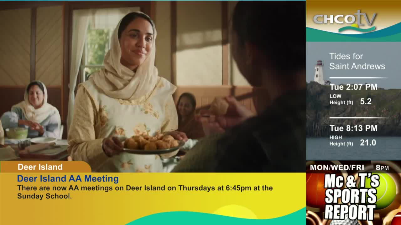 A woman in a head covering offers a plate of golden, round food to someone out of frame. The CHCO-TV broadcast also shows a lighthouse and tide information for Saint Andrews.
