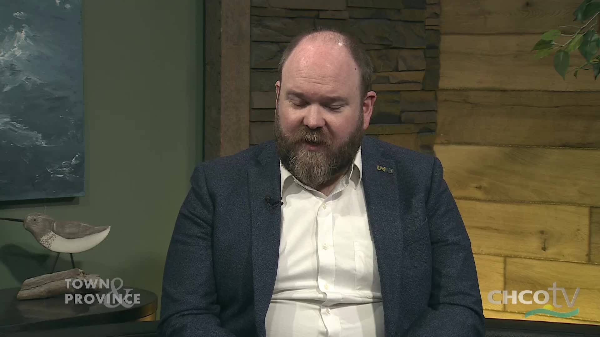 A man with a beard, wearing a blue jacket and white shirt, is speaking. The CHCO-TV logo is visible in the lower right corner. A man with a beard, wearing a blue jacket and white shirt, is speaking. The CHCO-TV logo is visible in the lower right corner.