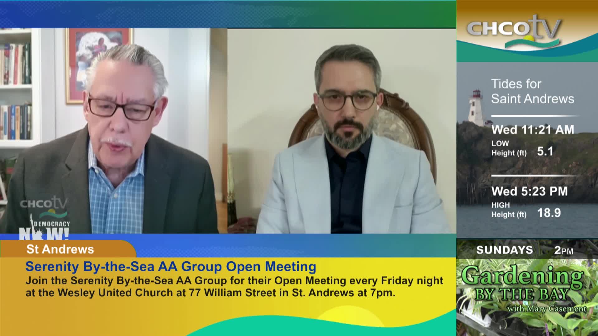 Two men are speaking on a screen, one with a grey suit and glasses, the other in a light jacket. A graphic displays tide times for Saint Andrews, New Brunswick, with a lighthouse in the background.