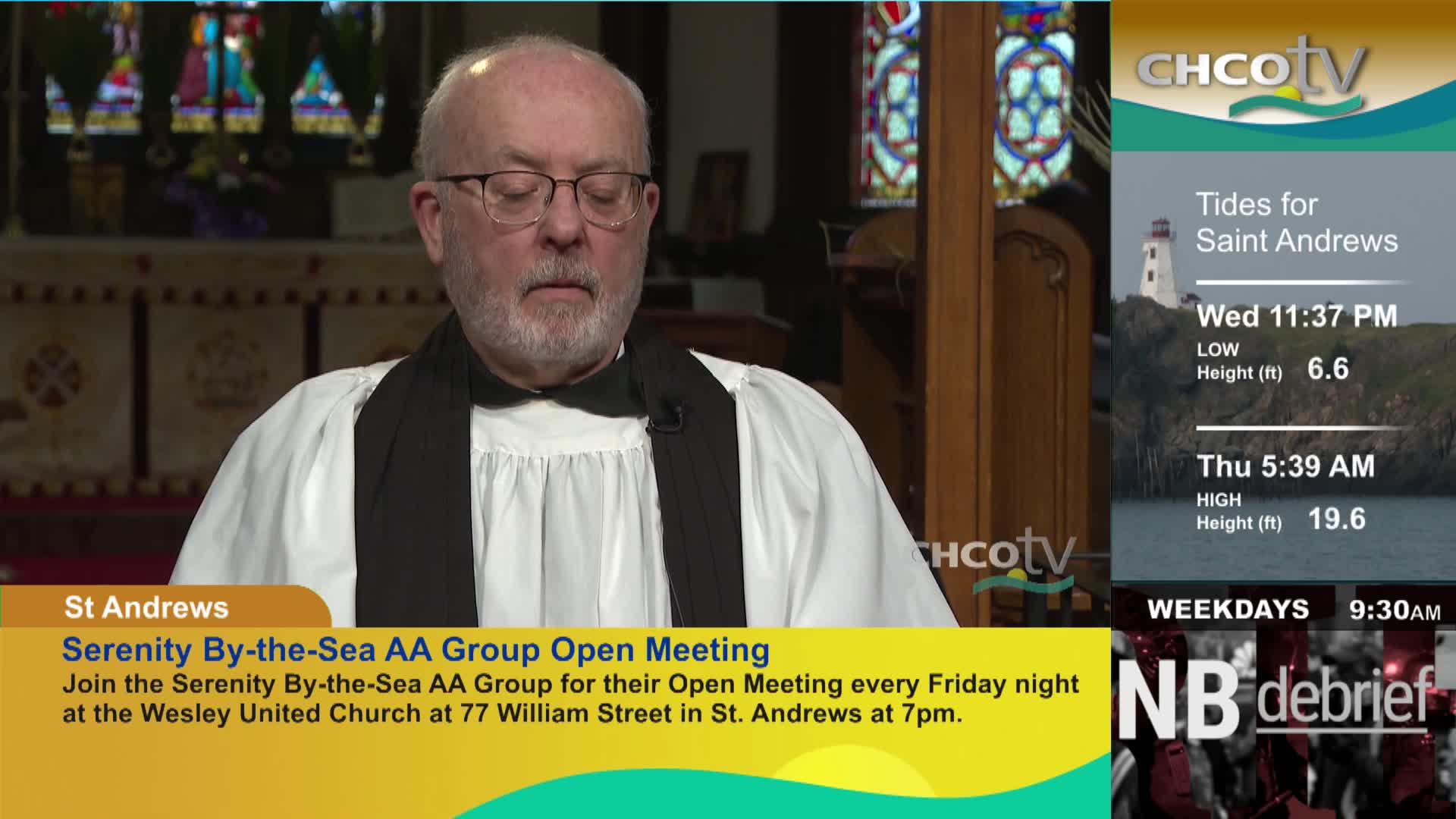 A man in clerical attire speaks from a church setting, with a CHCO-TV graphic overlaying the right side of the screen. Information about tides in Saint Andrews and an announcement for a local AA group meeting are also displayed.