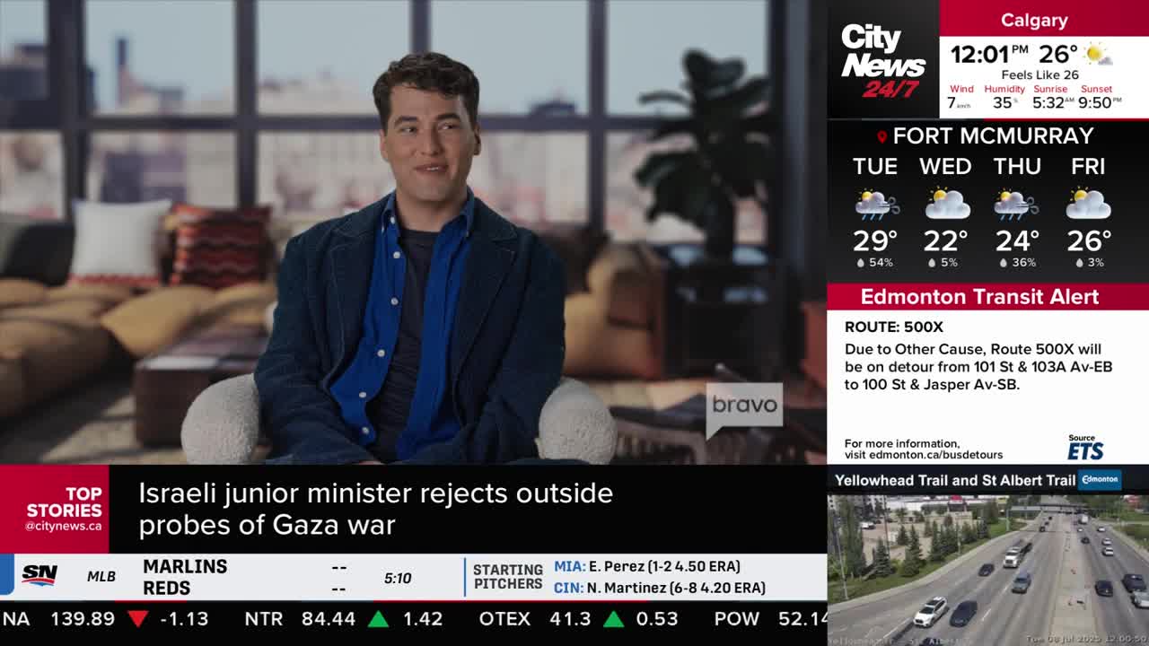 A man in a blue shirt and jacket sits in a well-lit room, smiling as he speaks. The CityNews Calgary logo and weather report are visible on the right side of the screen.
