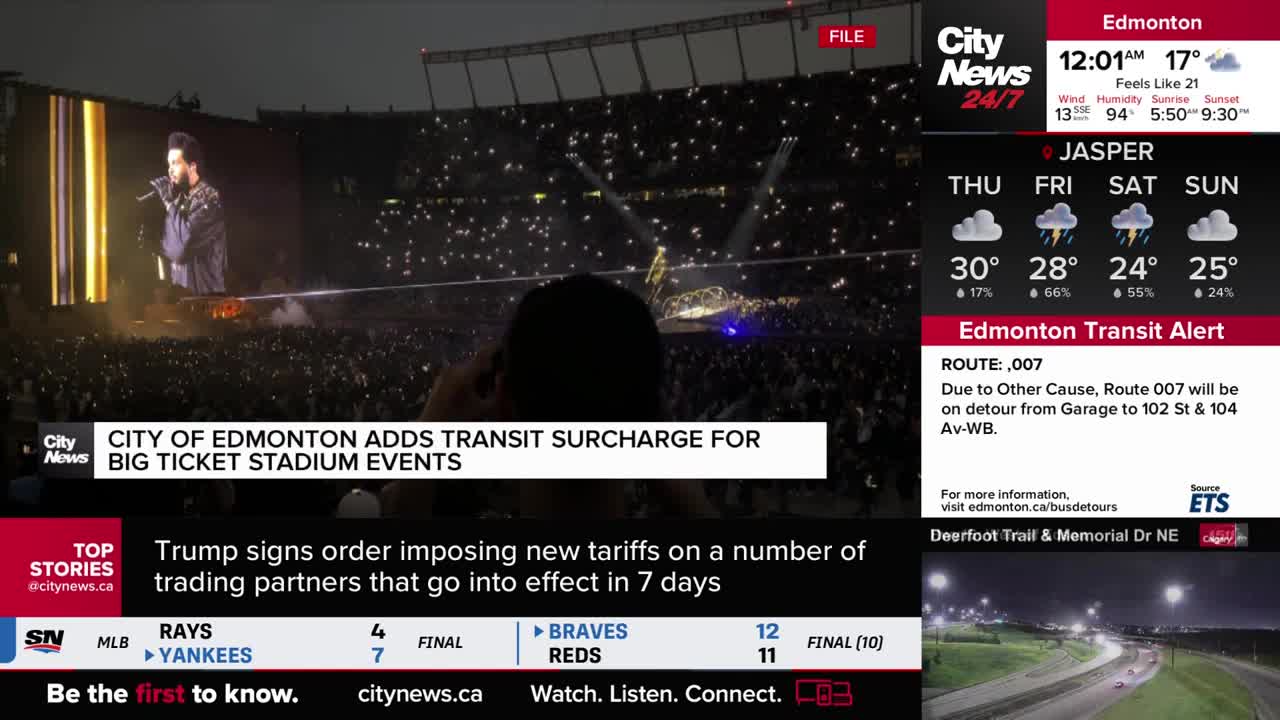 A performer with a microphone stands on a stage, bathed in bright light, as a massive crowd holds up glowing phones. The CityNews Calgary broadcast shows the concert scene, with news about transit surcharges overlaid.
