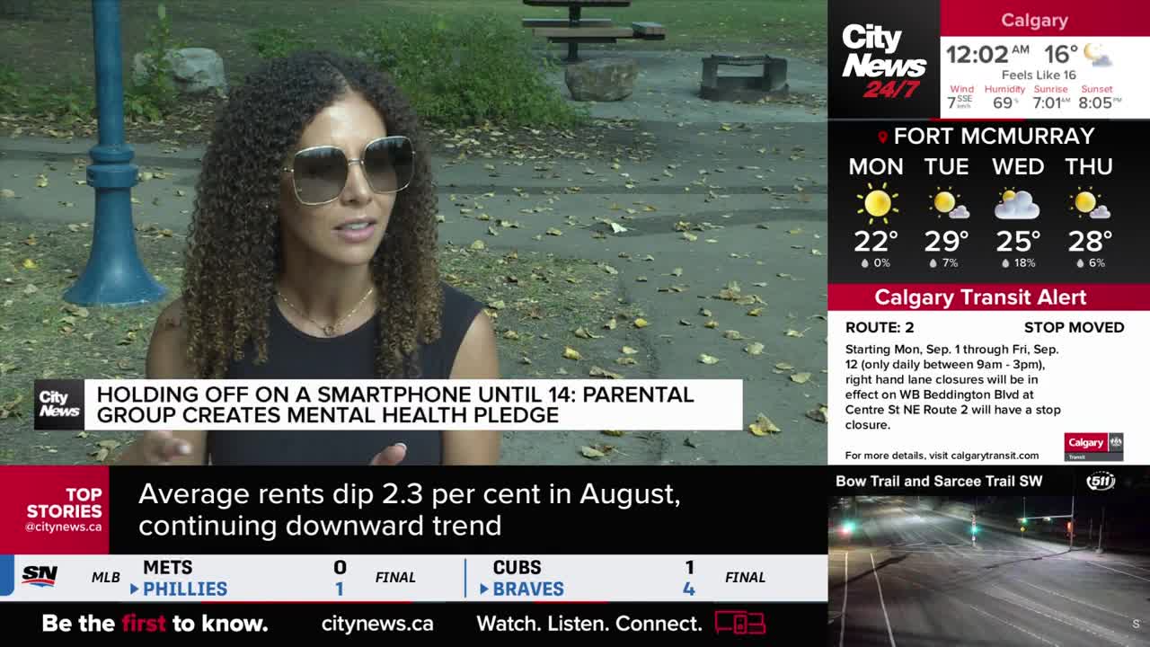 A CityNews Calgary reporter, wearing sunglasses, is speaking outdoors. The headline on the screen discusses a parental group's mental health pledge.
