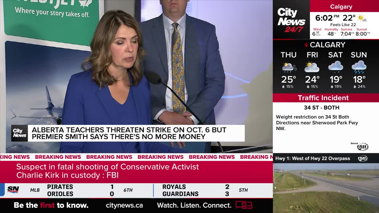 A woman in a blue blazer speaks into a microphone, with a man in a suit standing beside her. The CityNews Calgary logo is visible, and a headline flashes about a teachers' strike in Alberta.
