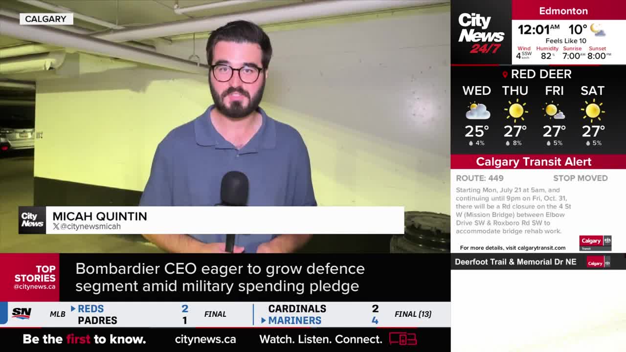 Micah Quintin from CityNews Calgary stands in what looks like a parking garage, speaking into a microphone. Behind him, a car is parked, and a screen displays the weather and transit alerts.
