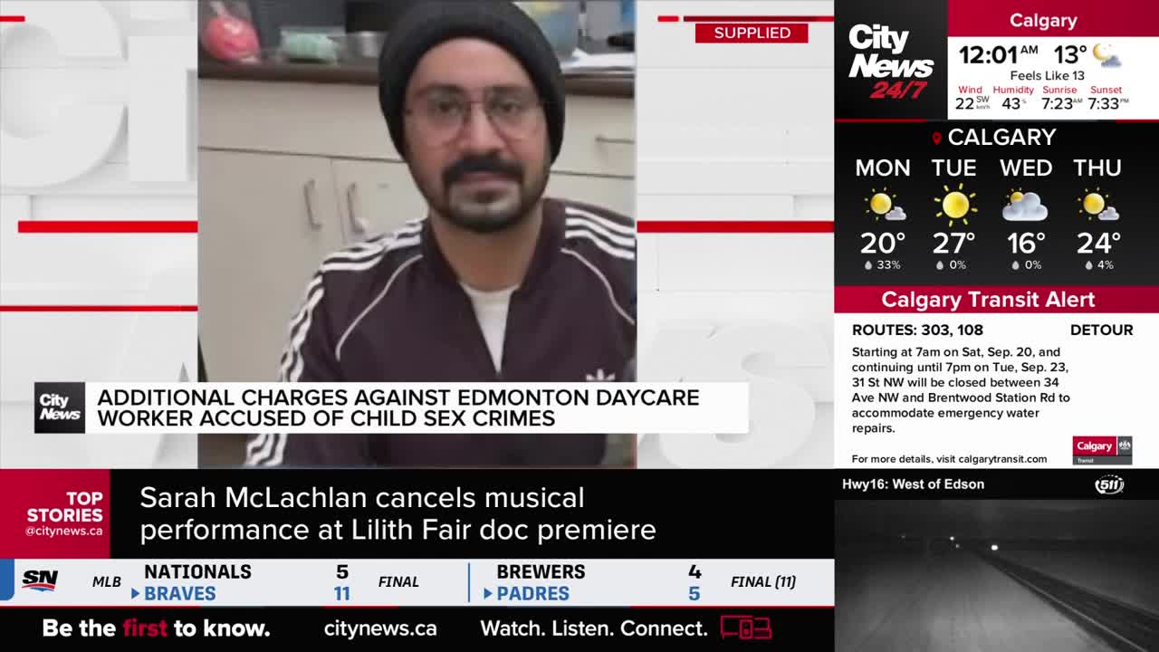 A man with a beard and glasses stares directly at the camera, framed by a CityNews Calgary graphic. Below, the screen scrolls through headlines, including a story about Sarah McLachlan.
