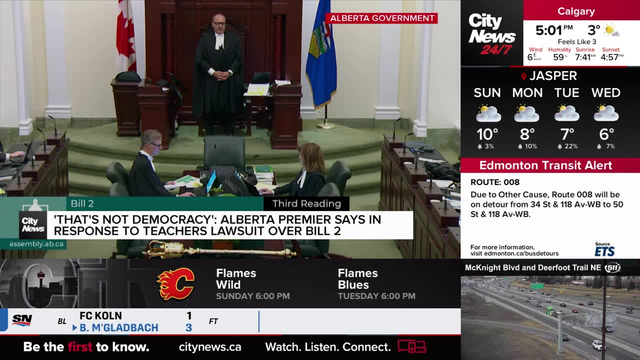 The Speaker, in a black robe, stands at the front of the room, while a woman in a suit sits at a desk. A CityNews Calgary graphic on the screen displays the weather forecast.
The Speaker, in a black robe, stands at the front of the room, while a woman in a suit sits at a desk. A CityNews Calgary graphic on the screen displays the weather forecast.
