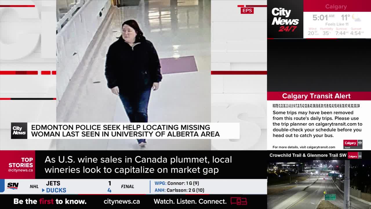 A woman in a dark jacket walks toward the camera in what appears to be a hallway, as CityNews Calgary reports on a missing person. The news ticker below highlights a transit alert and a story about Canadian wineries.
A woman in a dark jacket walks toward the camera in what appears to be a hallway, as CityNews Calgary reports on a missing person. The news ticker below highlights a transit alert and a story about Canadian wineries.