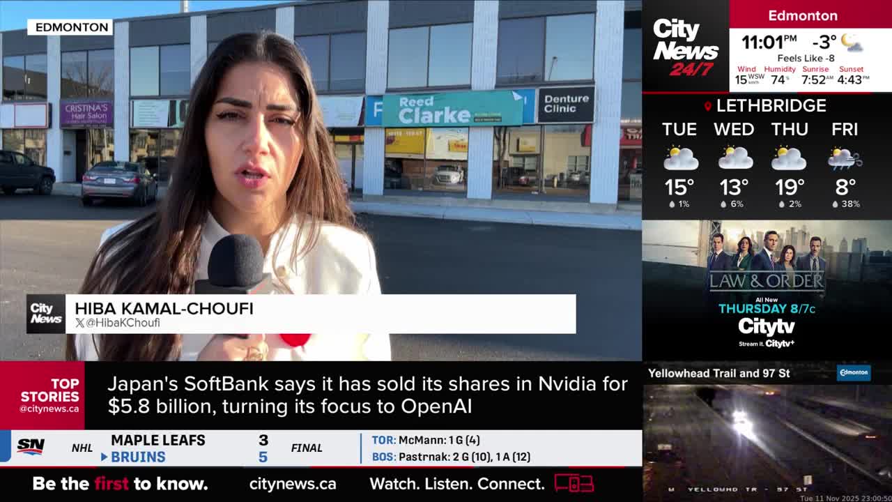 A CityNews reporter, Hiba Kamal-Choufi, is speaking into a microphone, standing in front of a strip mall. The screen shows the weather forecast for Lethbridge and a live shot of Yellowhead Trail and 97th Street, both in Canada.
A CityNews reporter, Hiba Kamal-Choufi, is speaking into a microphone, standing in front of a strip mall. The screen shows the weather forecast for Lethbridge and a live shot of Yellowhead Trail and 97th Street, both in Canada.
