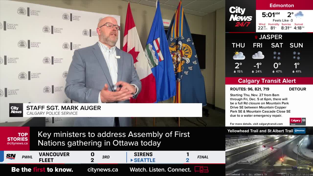 Staff Sergeant Mark Auger of the Calgary Police Service is speaking, his hands gesturing as he addresses the camera. Behind him, the Canadian flag and other provincial flags stand tall.
Staff Sergeant Mark Auger of the Calgary Police Service is speaking, his hands gesturing as he addresses the camera. Behind him, the Canadian flag and other provincial flags stand tall.