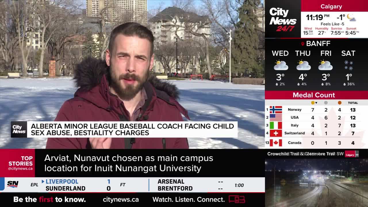 A reporter stands in a snowy park, speaking into a microphone. On the screen beside him, CityNews Calgary displays weather updates and a medal count for a competition.