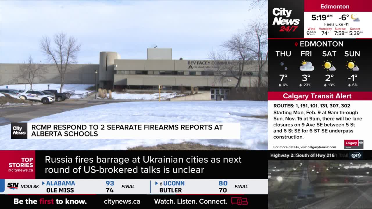 RCMP cruisers are parked outside Bev Facey Community High School. The snow-covered grounds are quiet, with no visible activity.