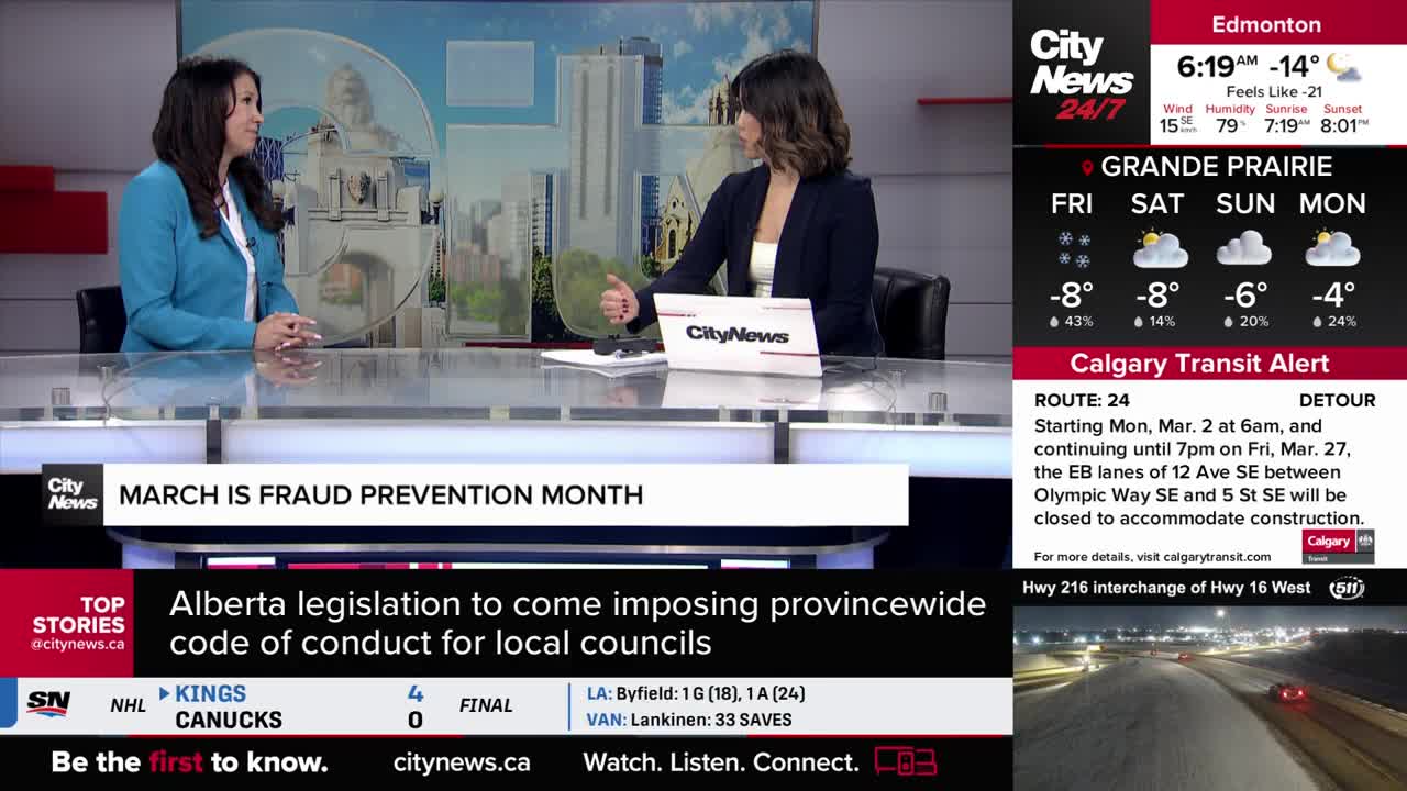 Two women sit at a desk in a studio, with a CityNews logo on the table between them. The screen displays weather updates for Edmonton and Grande Prairie, and a Calgary Transit Alert about Route 24.