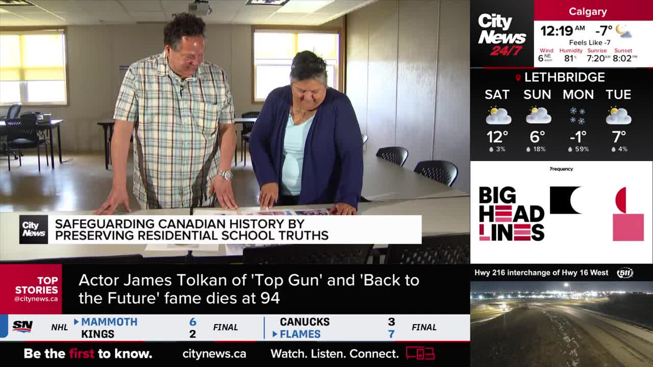 A man in a plaid shirt and a woman in a blue cardigan lean over a table, pointing at documents. A CityNews Calgary overlay displays the current temperature as -7 degrees.