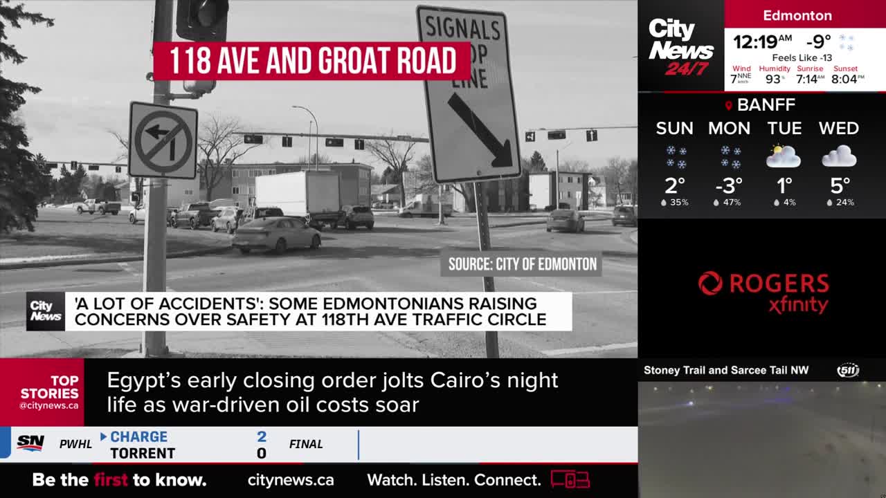 Cars are navigating a busy intersection at 118th Avenue and Groat Road in Edmonton. A CityNews Calgary report highlights concerns about accidents at this traffic circle.