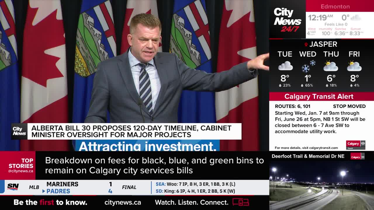 A man in a suit gestures emphatically in front of Canadian flags. On the screen, CityNews Calgary reports on Alberta Bill 30 and upcoming transit disruptions.
