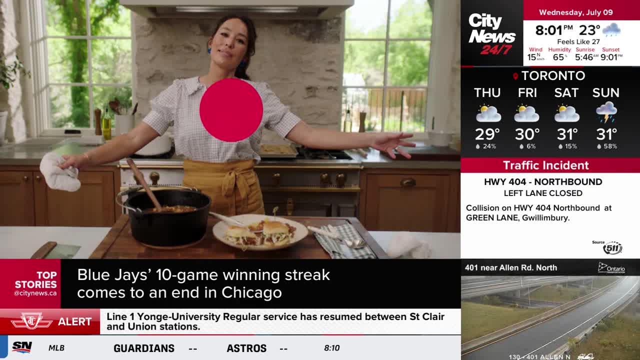 A woman in a kitchen, holding a pot holder, gestures with her arms as if presenting a meal. The CityNews Toronto graphic in the corner shows the weather forecast and traffic updates.
