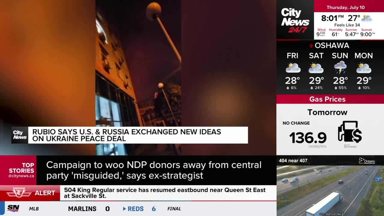 The CityNews Toronto screen shows a street scene at night, with a headline about U.S. and Russia peace talks. Above the news, a weather report for Oshawa and gas prices are displayed.
