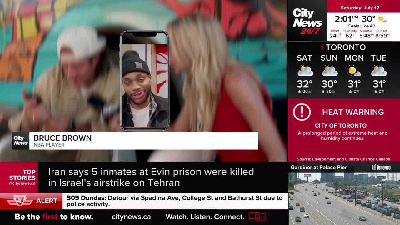 CityNews Toronto is reporting on a video call with Bruce Brown, the NBA player, as two people in the background are slightly out of focus. The screen shows a heat warning for the city, with a temperature of 30 degrees.
