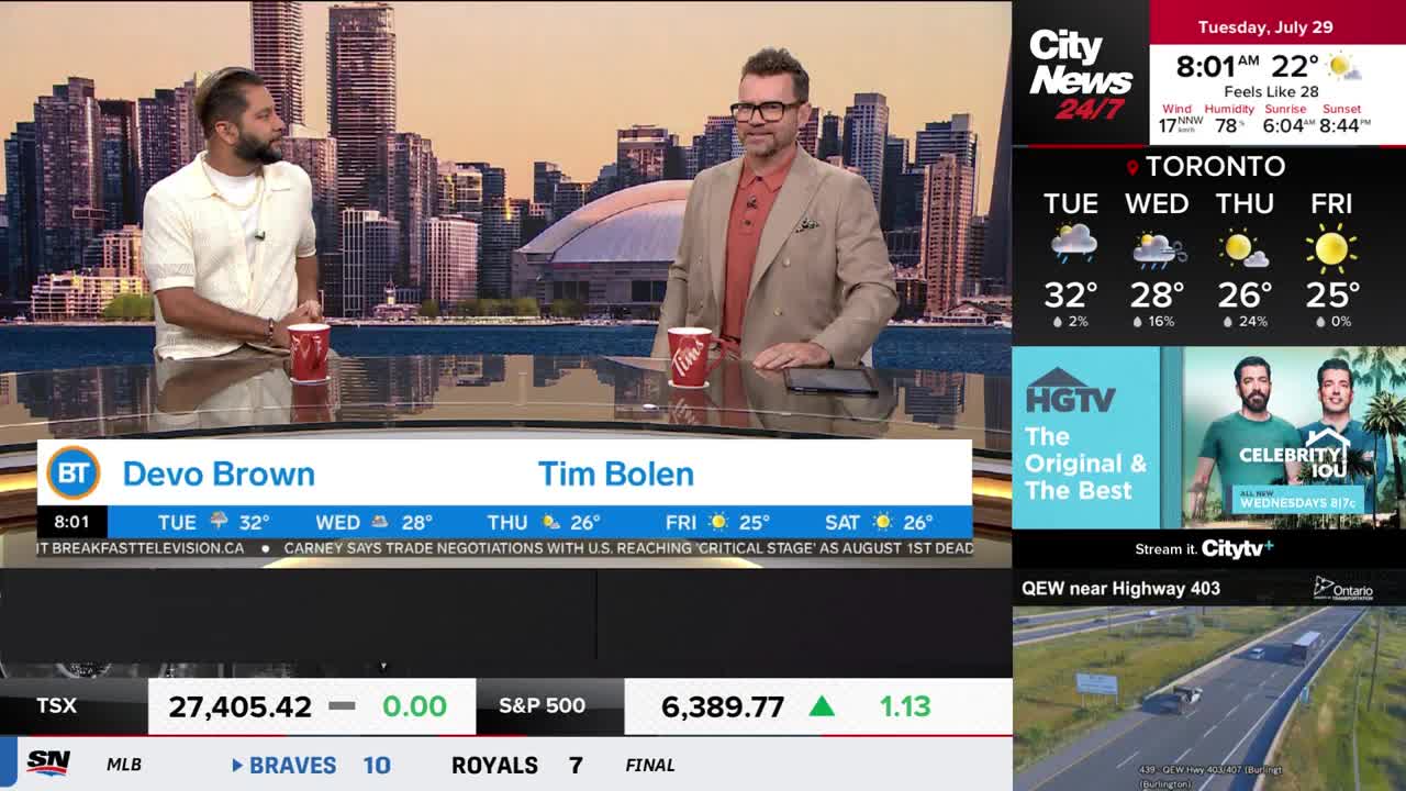 Two men, Devo Brown and Tim Bolen, stand behind a desk, each with a red mug. CityNews Toronto's weather report and the Toronto skyline are visible in the background.

