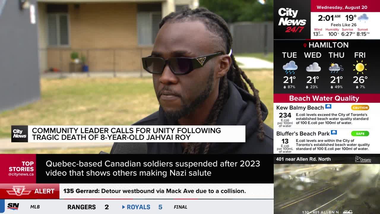 A man wearing dark sunglasses speaks to the camera, his words likely about the tragic death of an 8-year-old, as reported by CityNews Toronto. The weather forecast for Hamilton and beach water quality reports are displayed on the screen beside him.
