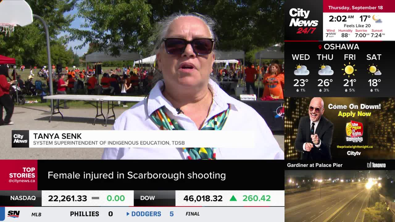 Tanya Senk, the System Superintendent of Indigenous Education, is speaking to the camera, with a crowd wearing orange shirts visible in the background. The CityNews Toronto logo is in the corner, and the weather report for Oshawa is displayed.
