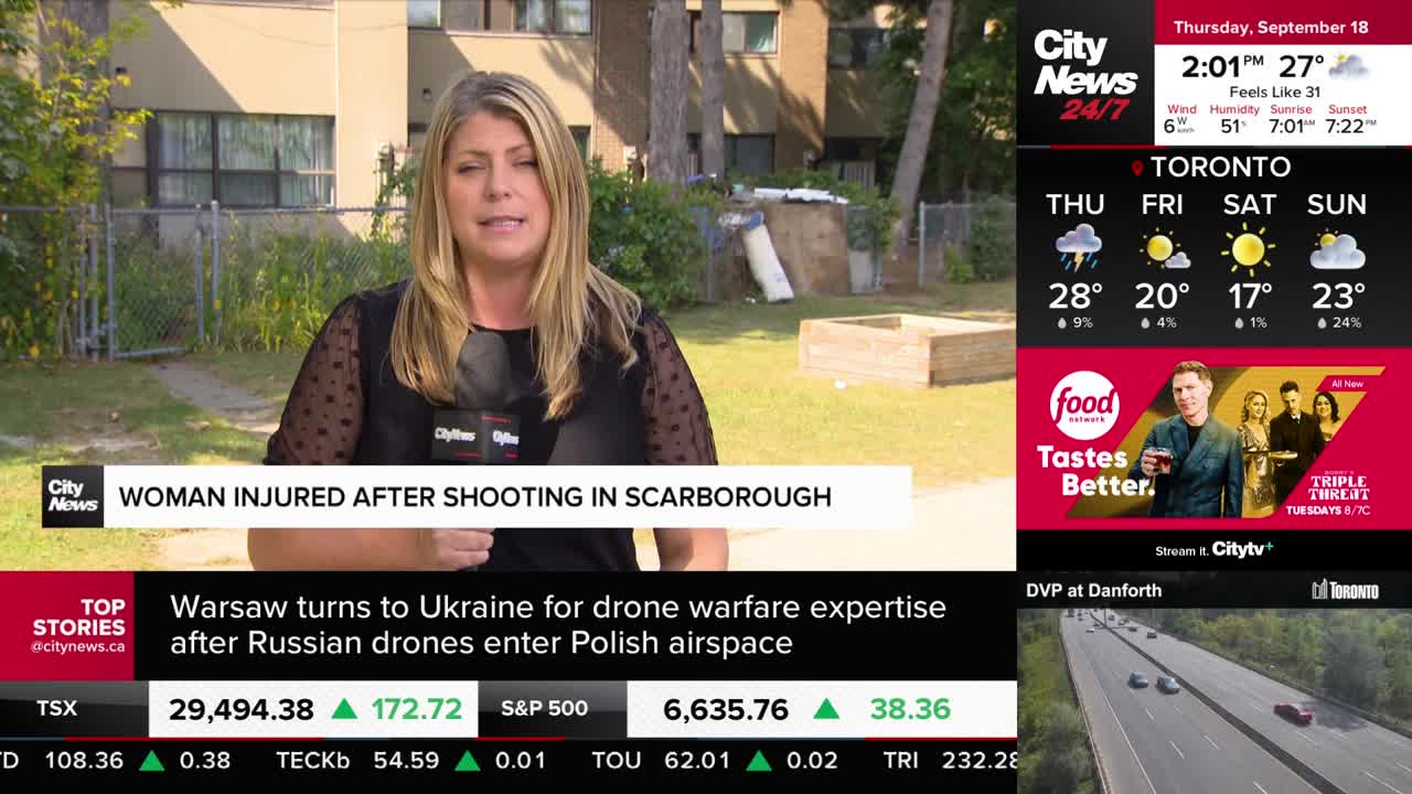 A CityNews Toronto reporter is standing in front of a camera, speaking about a shooting in Scarborough. Behind her, a residential building and some greenery are visible.
