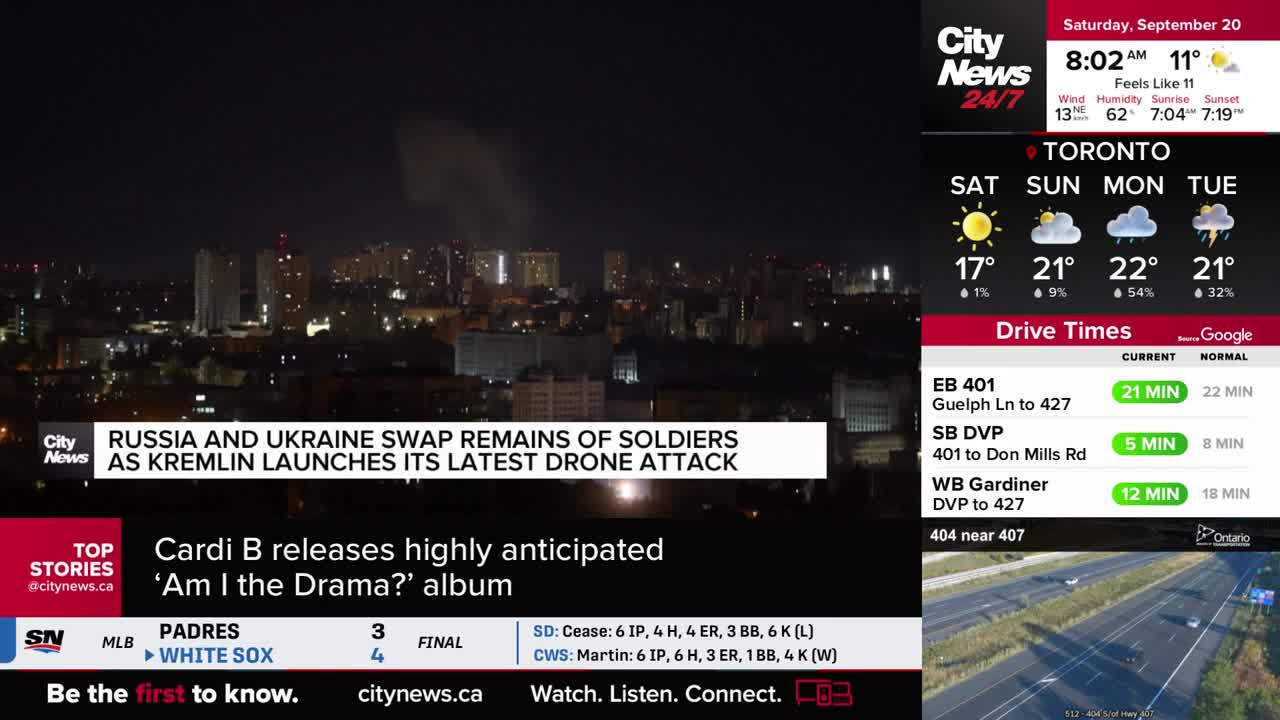 Over a cityscape, a plume of smoke rises against the dark sky, as reported by CityNews Toronto. The news ticker highlights a story about the Russia-Ukraine conflict and a drone attack.
