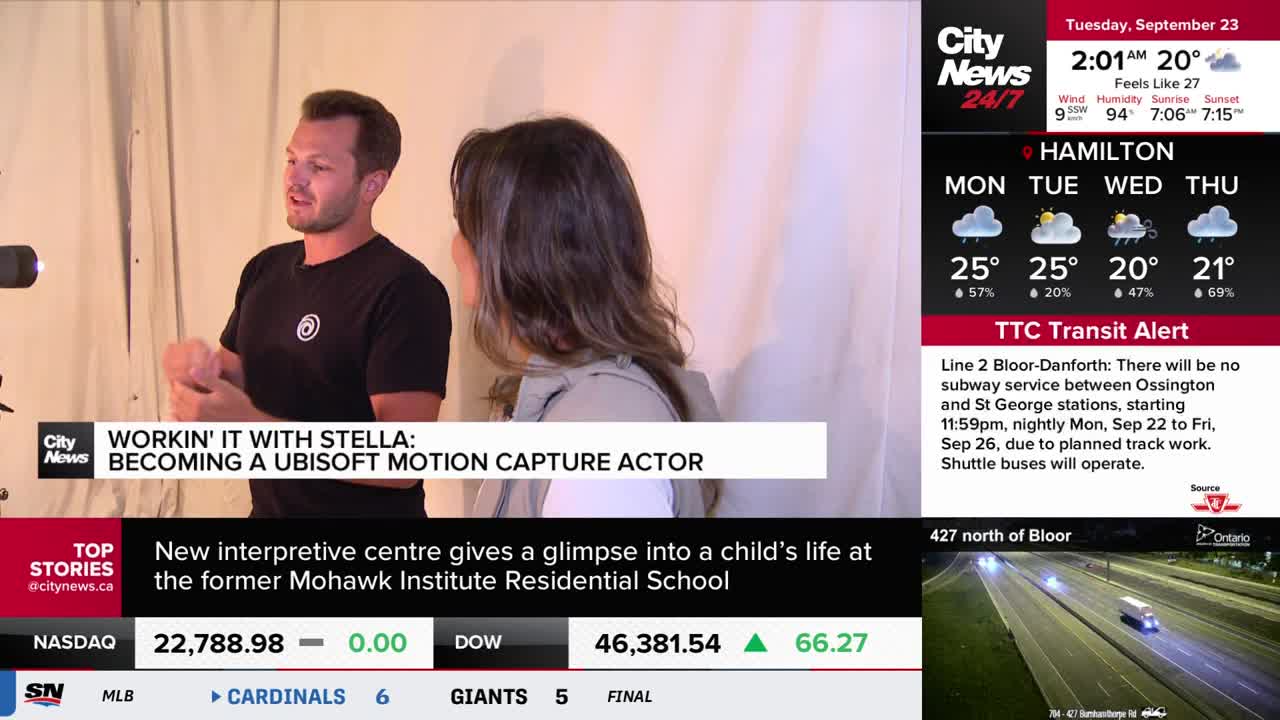 A man in a black t-shirt gestures with his hands while speaking to a woman. The CityNews Toronto graphic at the bottom of the screen indicates they're discussing motion capture acting.
