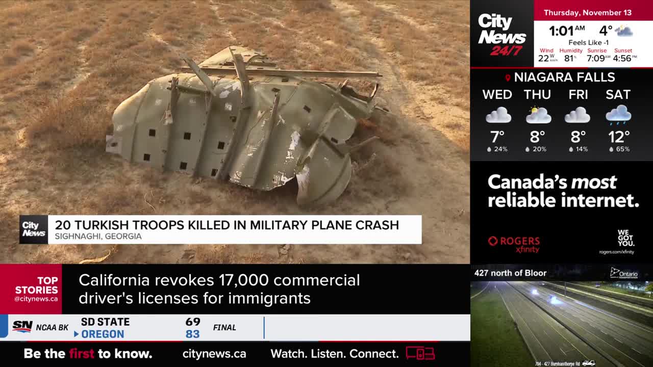 Scattered metal wreckage sits on a field of dry grass, as reported by CityNews Toronto. The twisted, gray pieces are the remains of a military plane.
